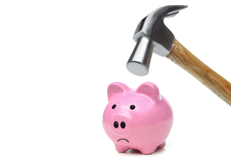 Hammer raised above a frowning piggy bank