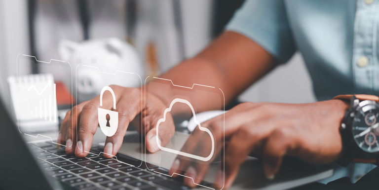 Hands typing on a laptop with overlaid icons of a chart, a padlock, and a cloud