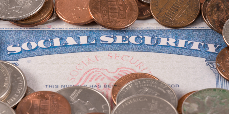 Social Security card surrounded by coins